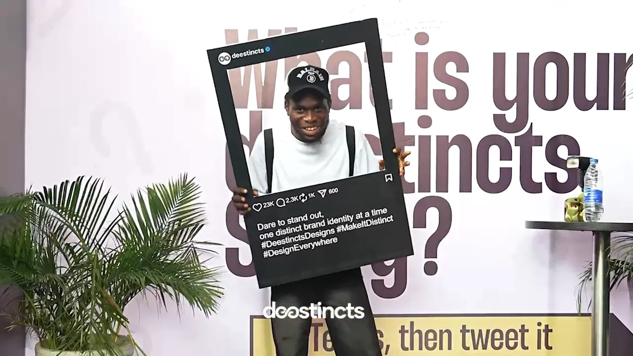 A participant posing with the 'What is your Deestincts story?' frame